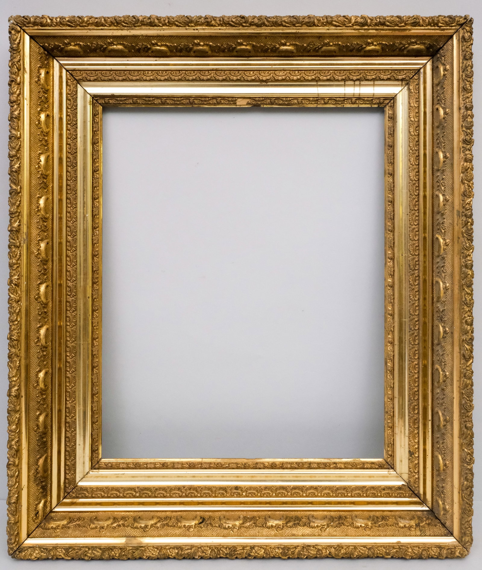 American Hudson River School Frame 16" x 20": American, circa 1880, with an acanthus decorated panel and decorative top edge, in a great standard size. Overall 24" x 28", rabbet 16" x 20", molding 4 1/4".