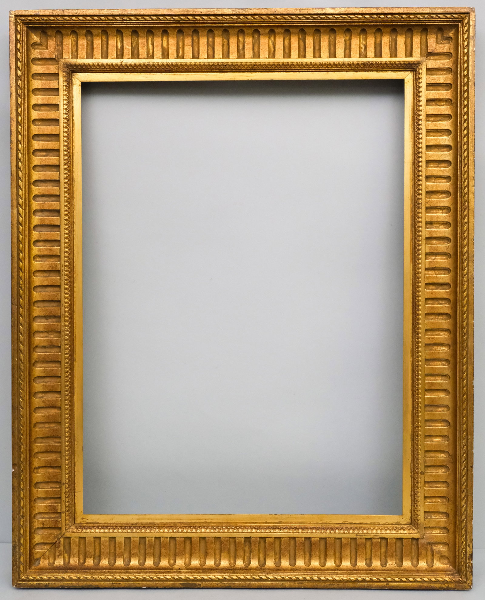 Neoclassical Fluted Cove Frame 22 1/2" x 30": French, ca. 1850, having brightly gilded fluted cove with flat top edge. Overall 31" x 38 1/2", rabbet 22 1/2" x 30", molding 4 3/4".