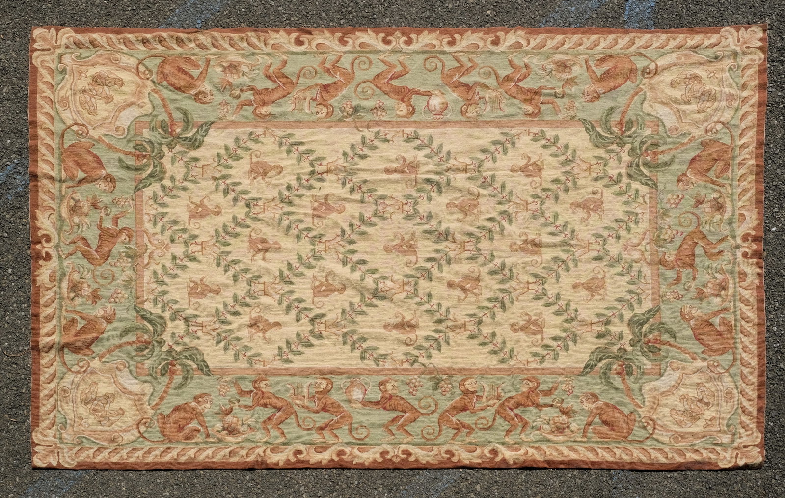 Vintage French Aubusson Needlepoint Rug 102" X 66": 20th century, likely France. The charming pictorial carpet features a monkey dinner party as the border and general theme. Measures 102" X 66".