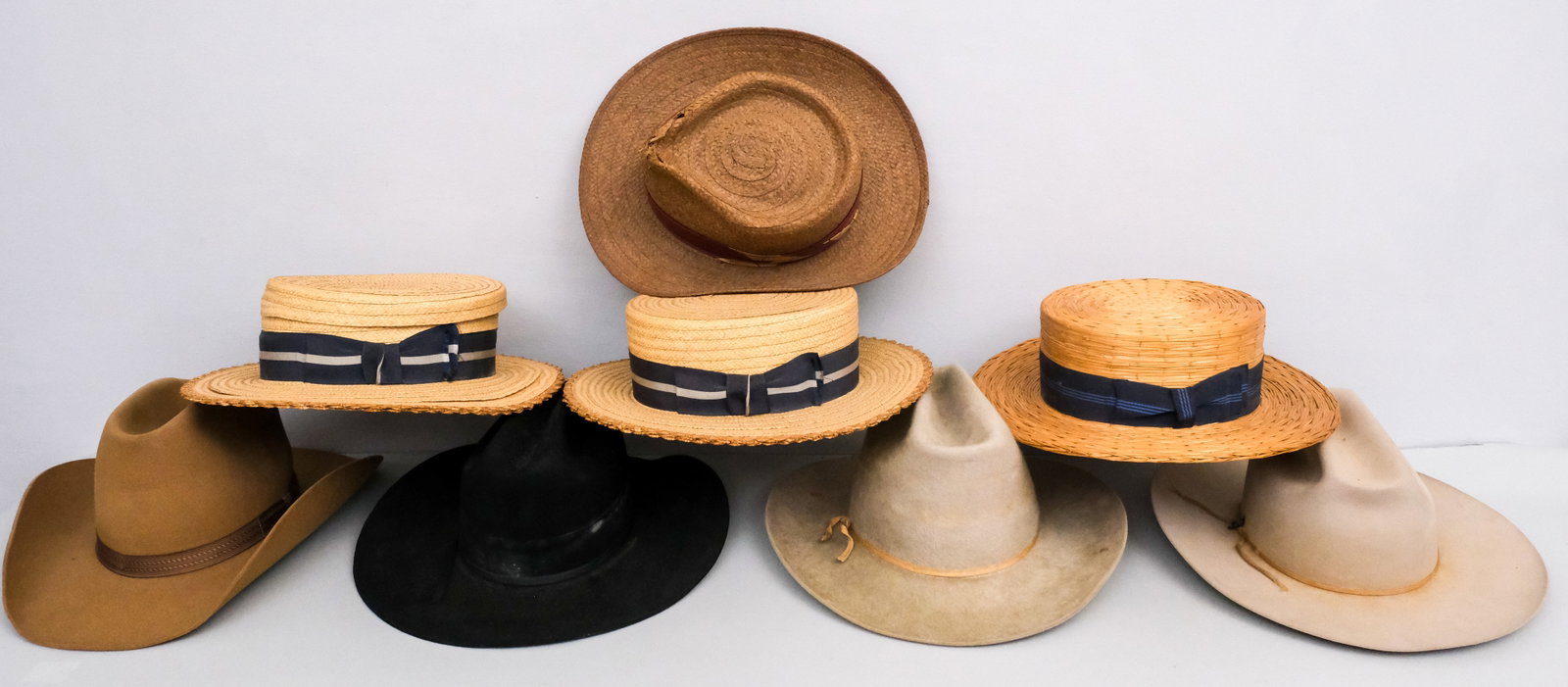 Lot of Men's Hats: Lot consisting of men's hats, including Western beaver hats from Resistol, Bradford, Stetson, Wrangler, and woven boat hats from Dobbs and The Packard Hat, all between size 6 5/8 and size 7.