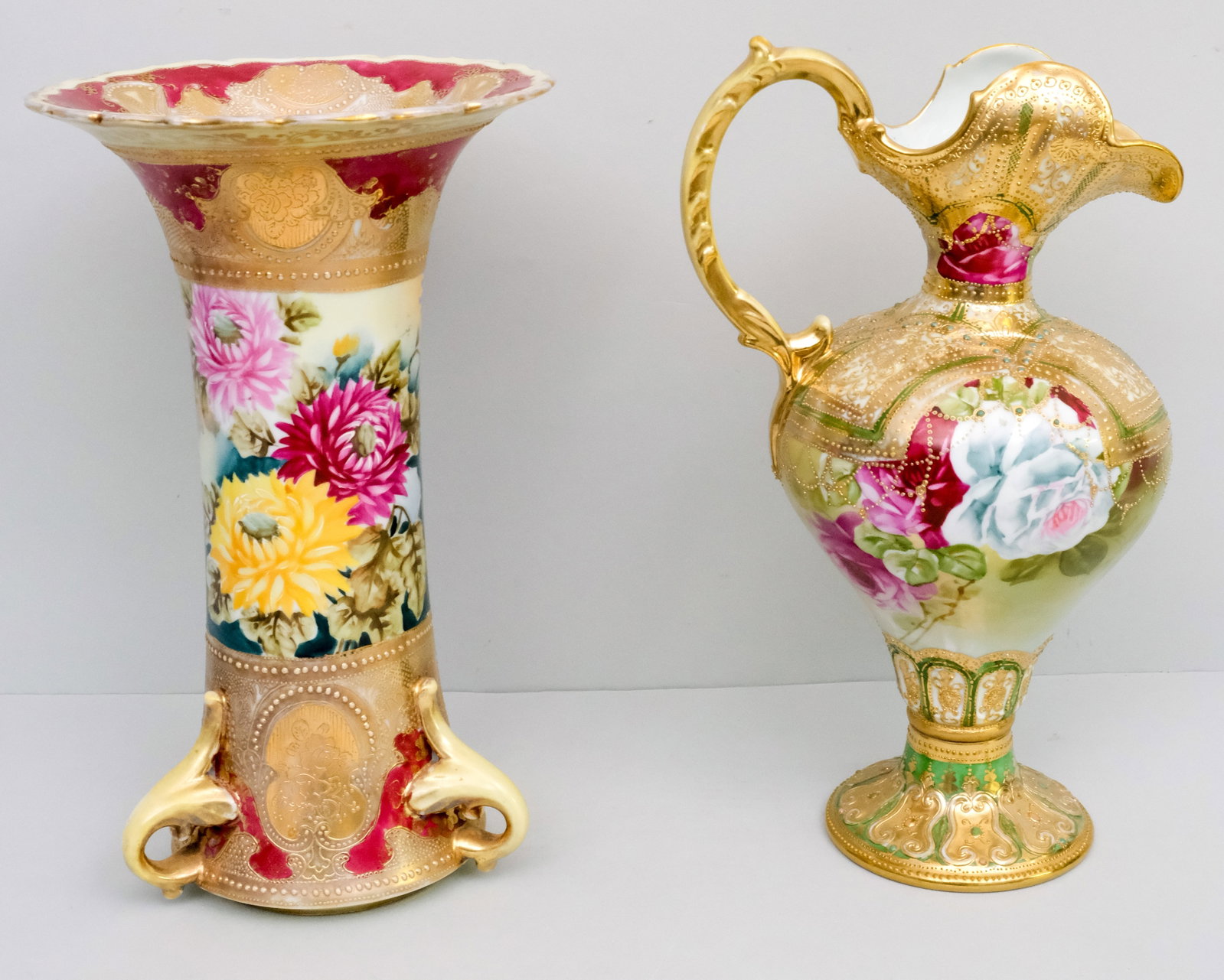 Antique Nippon Porcelain Vase & Ewer: Comprising an early Morimura Gumi ewer with jewelled Moriage and rose decor, and a Morimura vase with jewelled Moriage. 13 1/2" and 13 3/4".