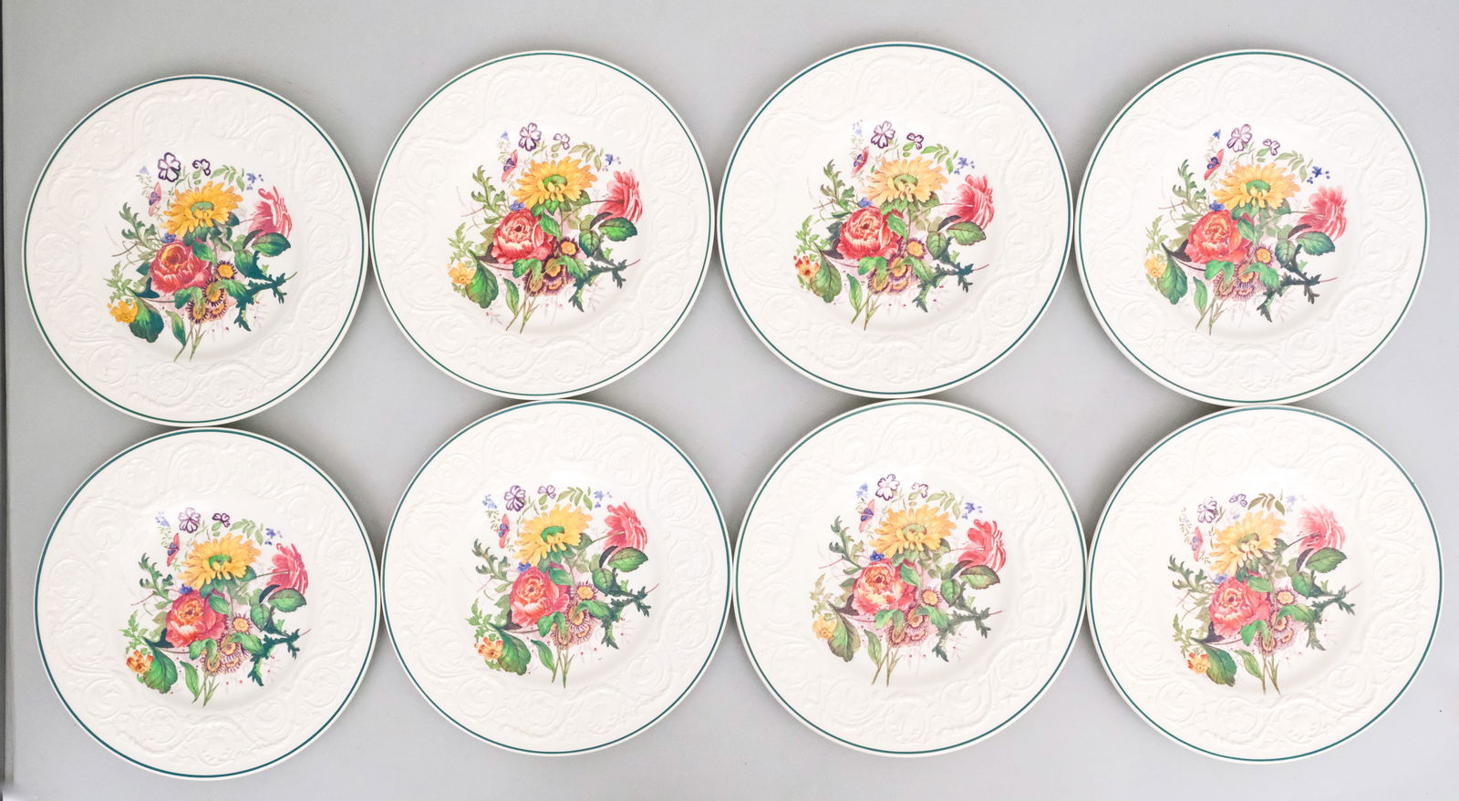 Set 8 Antique Wedgwood Embossed Dinner Plates: Floral decorated plates. Marked as shown. 10 3/4".
