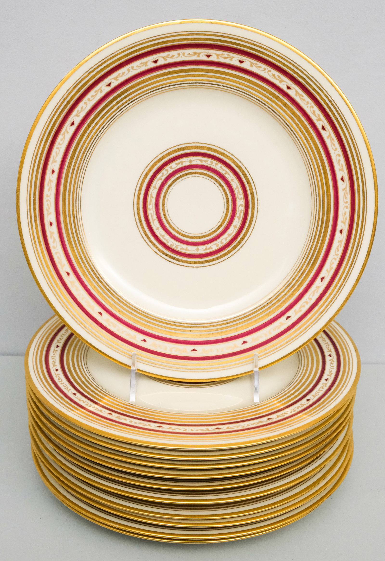 Set 11 Hutschenreuther Porcelain Plates: Gilded Plates with maroon piping. 10 3/4" diameter.