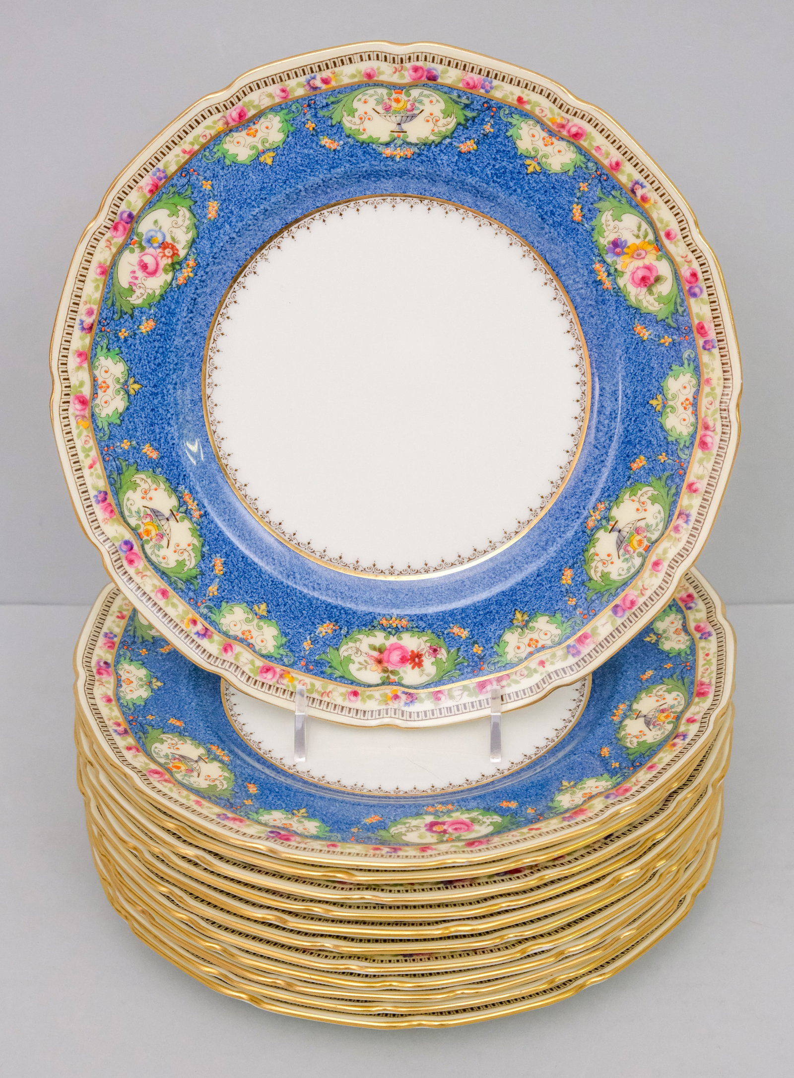 Set Royal Doulton Powder Ground Dessert Plates: With over enamel decoration. Retailed by Bailey, Banks, and Biddle. 9 1/8".