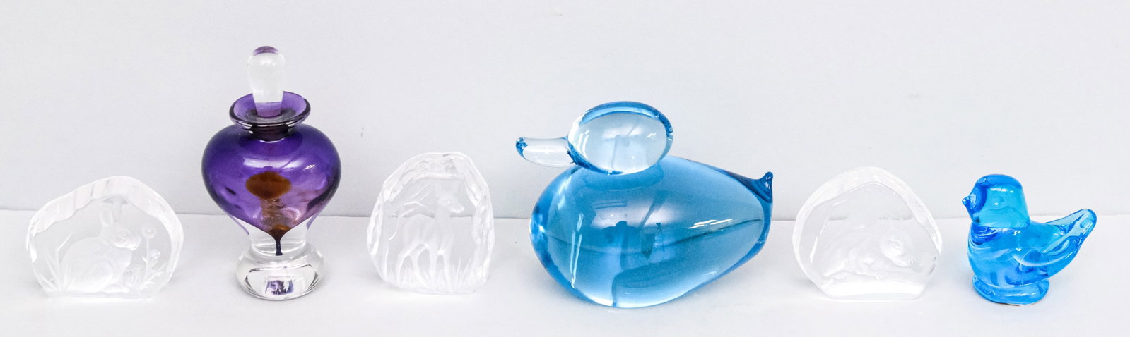 Collection of Signed Art Glass: Comprising three Copeland "rock" figurines, a Titan Art Glass bird, a Runyon perfume, and an unsigned duck. Duck 5".