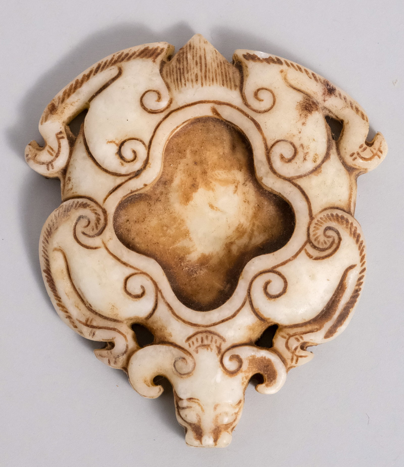 Antique Chinese Stone Carving of a Bat: Flat form with inset at center and carved details. 2 3/4" x 3".