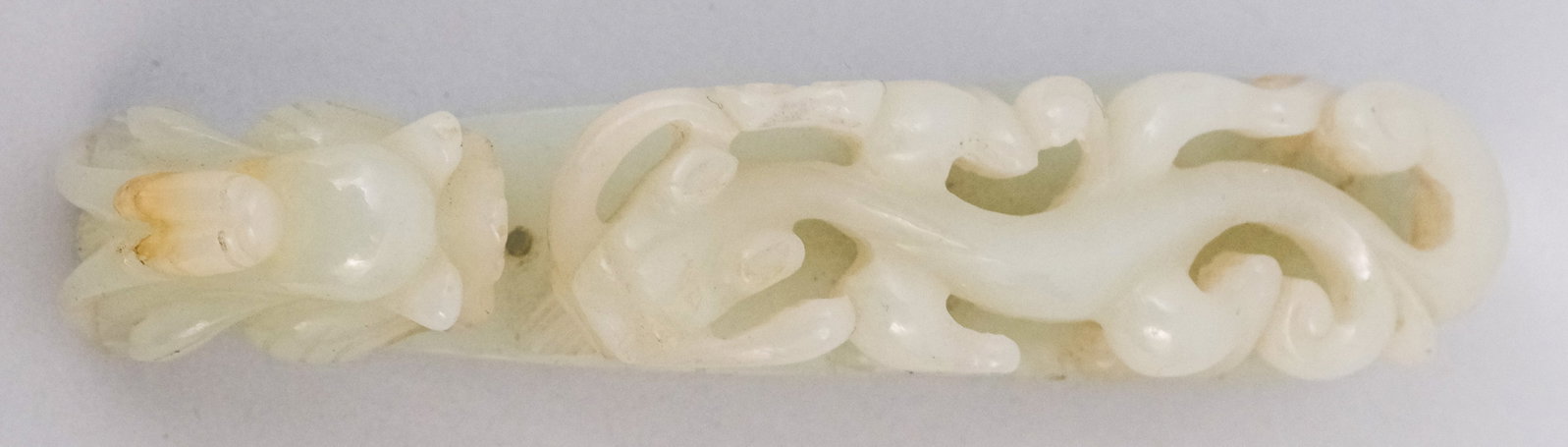 Antique Chinese Carved Jade Robe Toggle: In the form of a curling dragon. 3 1/4".