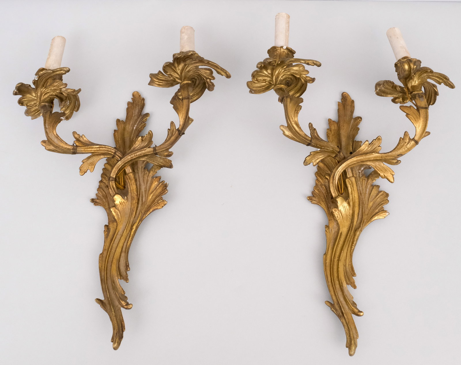 Pair Antique Rococo Gilt Brass Wall Sconces: With faux candle sockets. 18".