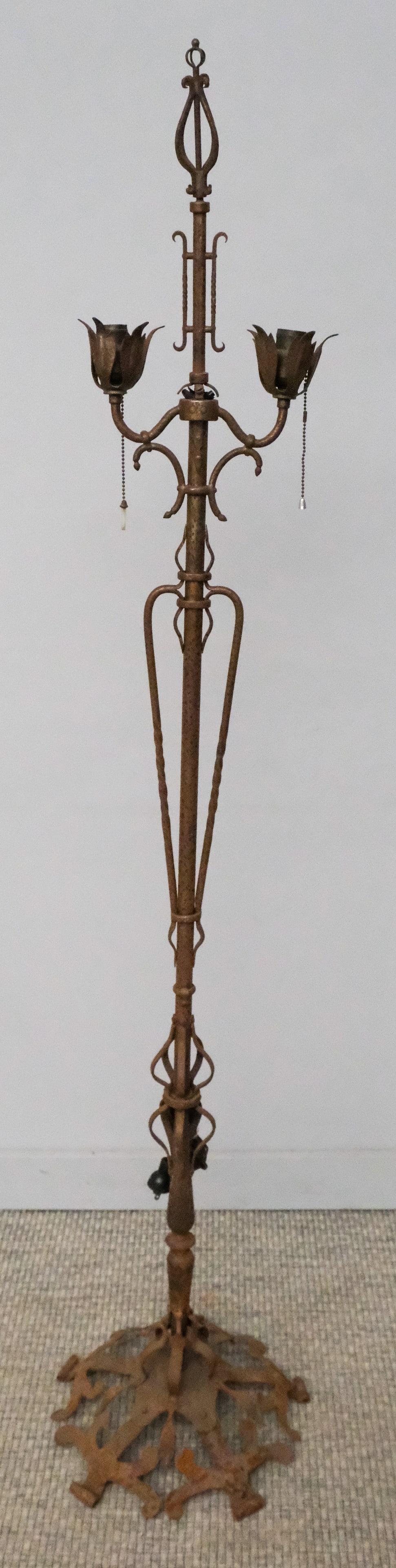 Antique Art Deco Floor Lamp: Late 19th century Art Deco, scrolled metal floor lamp with dual light fixtures, 67" H x 14" W x 14" L.