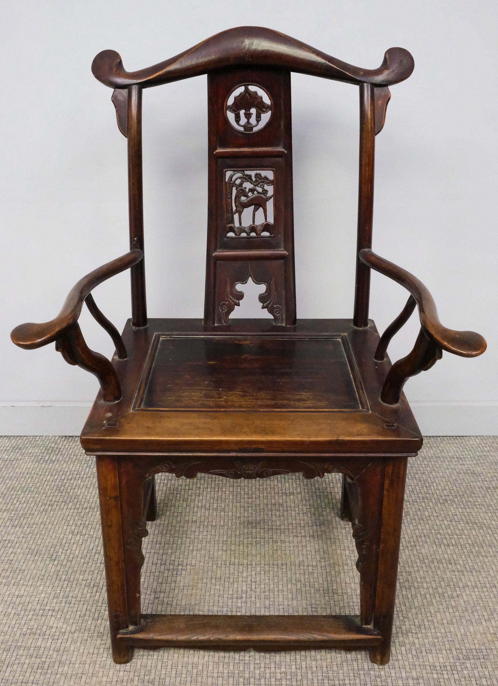 Chinese Hardwood Yoke Back Chair: Chinese, 20th century carved hardwood yoke back chair with curved arms and wide seat, 46" H x 26 1/2" W x 20" L.