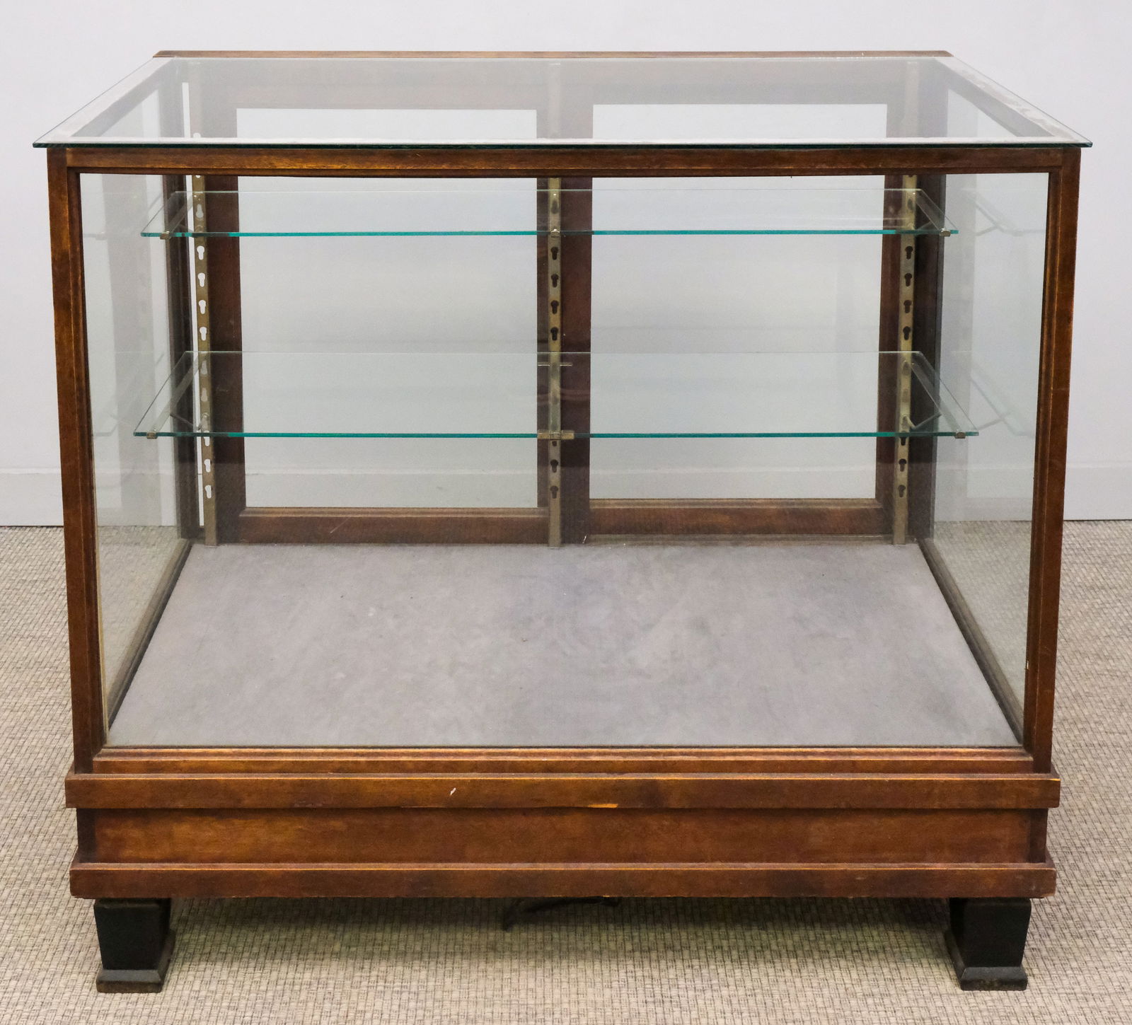 Antique General Store Display Case: Early 20th century glass general store display case with three shelves, 42" H x 46" W x 24" L.