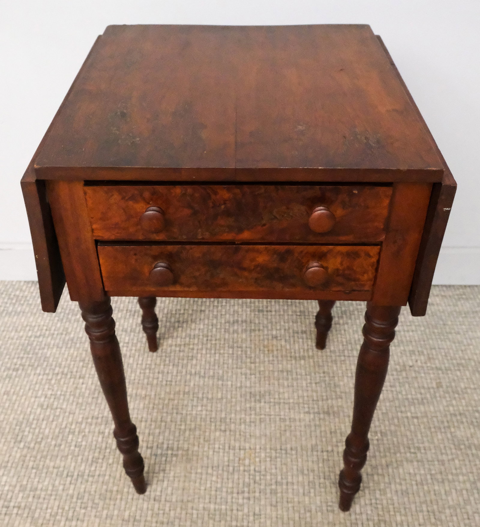 Two Drawer Empire Side Table: Early 19th century two drawer side table with burlwood veneer, turned legs, 29" H x 18 1/2" W x 18" L.
