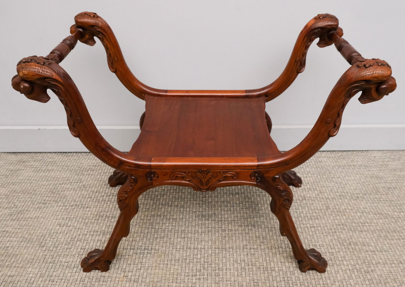 Carved Italian Renaissance Revival Curule Stool: Late 19th century carved Italian Renaissance Revival curule stool with dragon-form frame, 23 1/2" H x 29" W x 16 1/4" L.