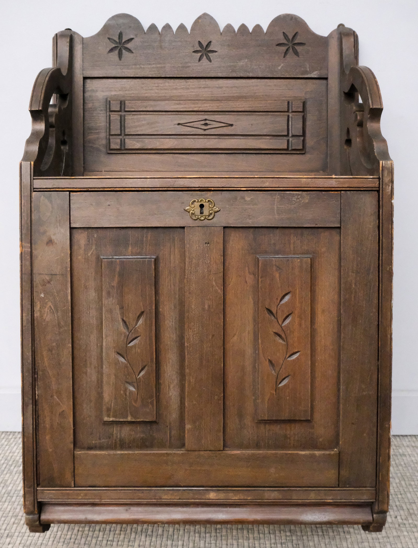 Wall Mounted Eastlake Drop Front Desk: Early 20th century East Lake style wall mounted, drop front desk with interior shelves, one drawer, and red felt-lined writing surface, 38 1/2" H x 23 1/2" W x 9 1/2" L.