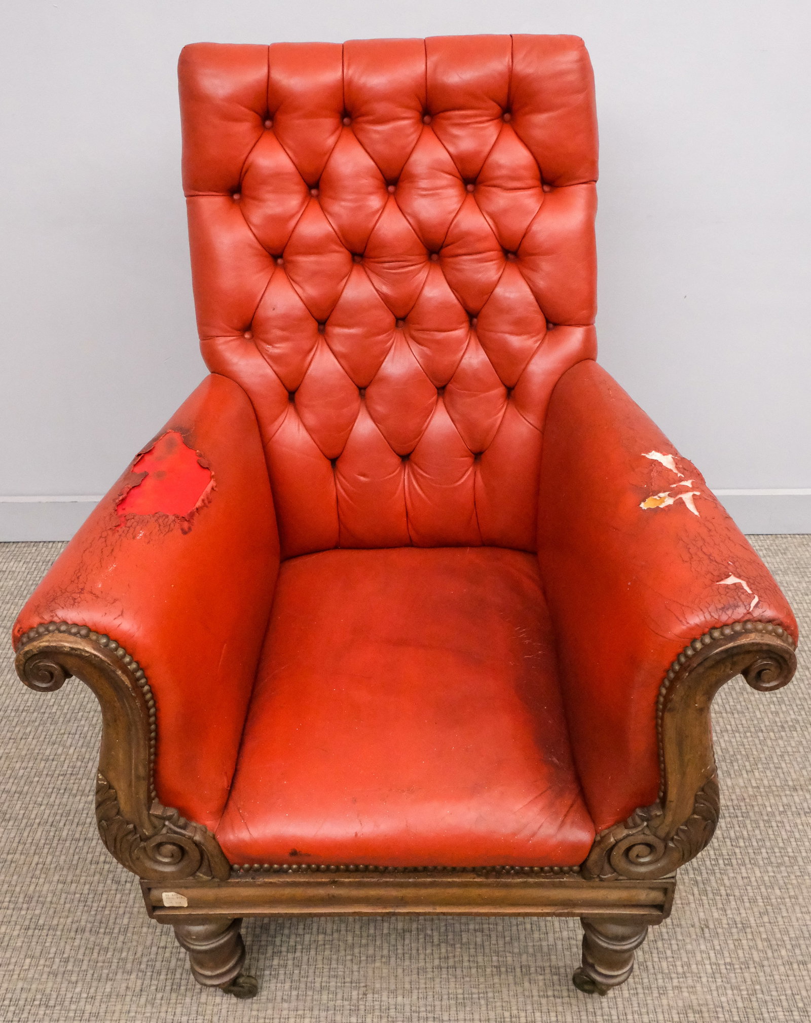 19th Century Rosewood Armchair: 19th century rosewood armchair in later red leather with tufted back, on turned front legs, 44" H x 32" W x 30" L.