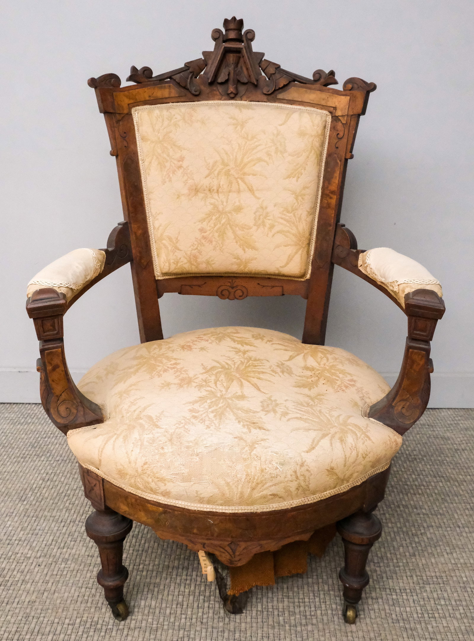 Antique Eastlake Armchair: Late 19th century Eastlake armchair with carved frame, rounded seat, 43" H x 29" W x 23" L.