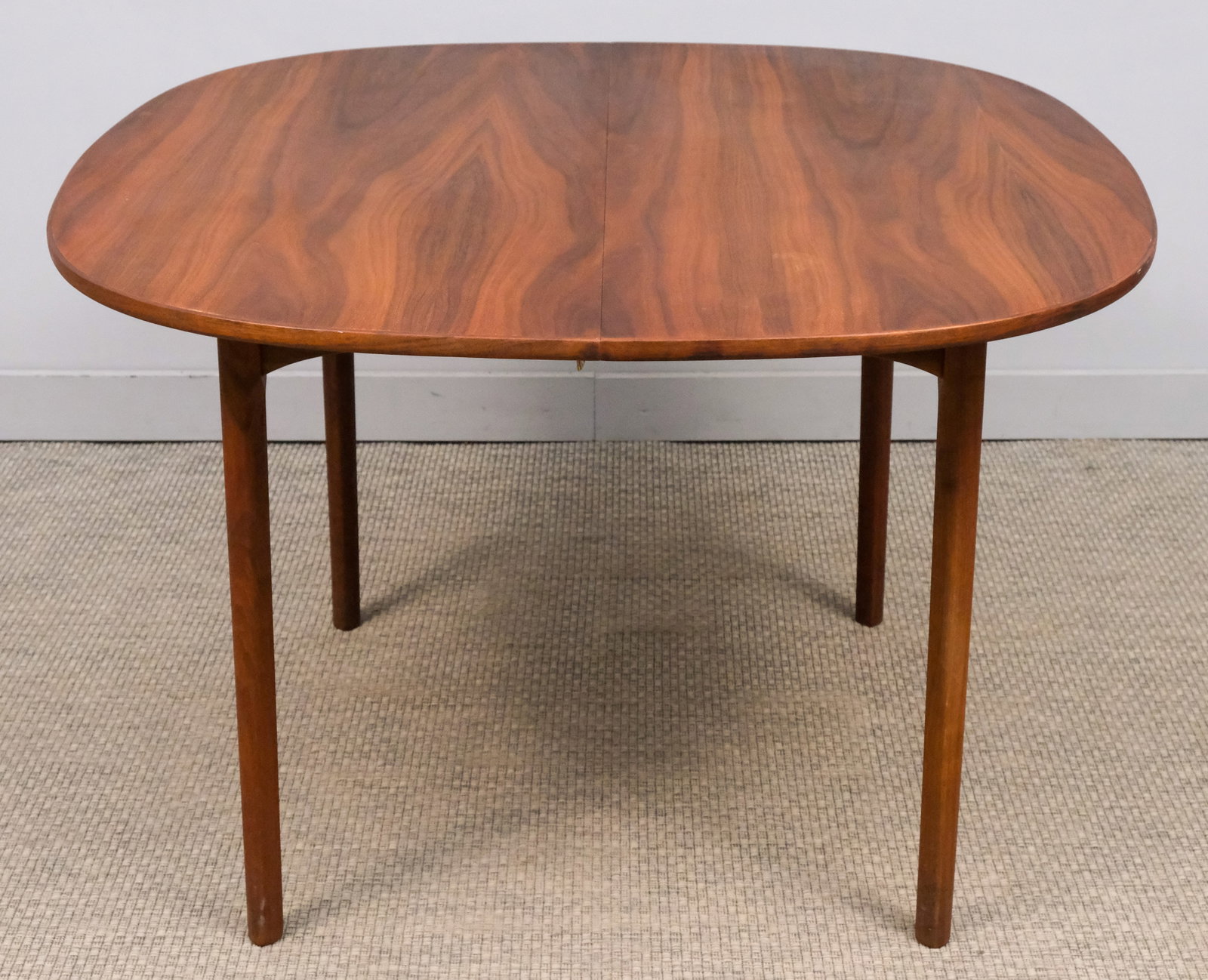 Mid-Century Modern Style Table: Mid-century modern style table with two leaves, with rounded edges, tapered legs, brass hardware under the table, 29 1/4" H x 44 3/4" W x 44" L, each leaf is 44 3/4" x 15".