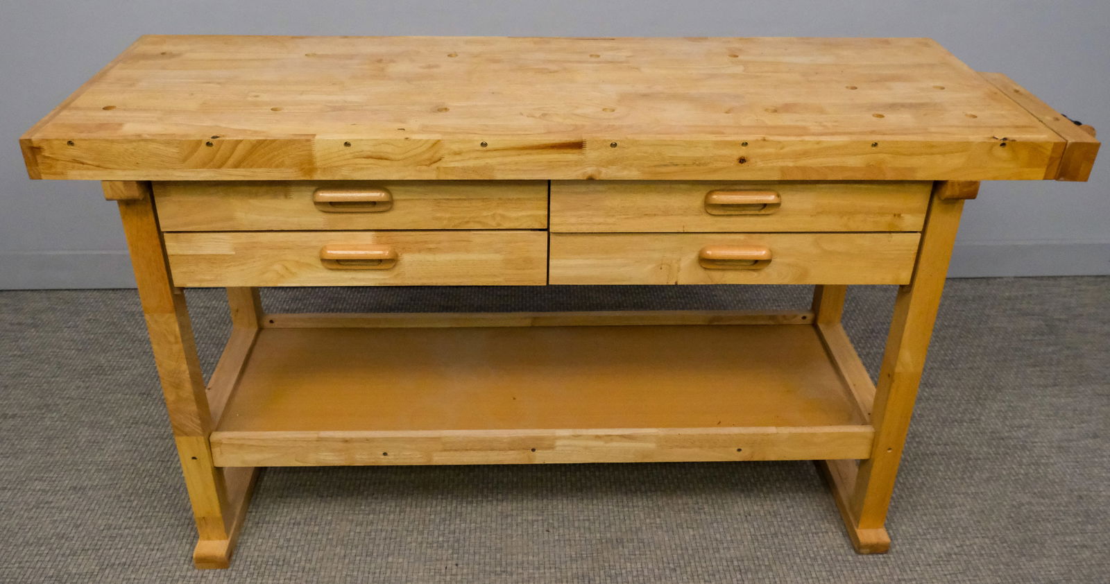 Industrial Workbench with Vise: 20th century industrial workbench with vise, four drawers, 34" H x 64" W x 20" L.