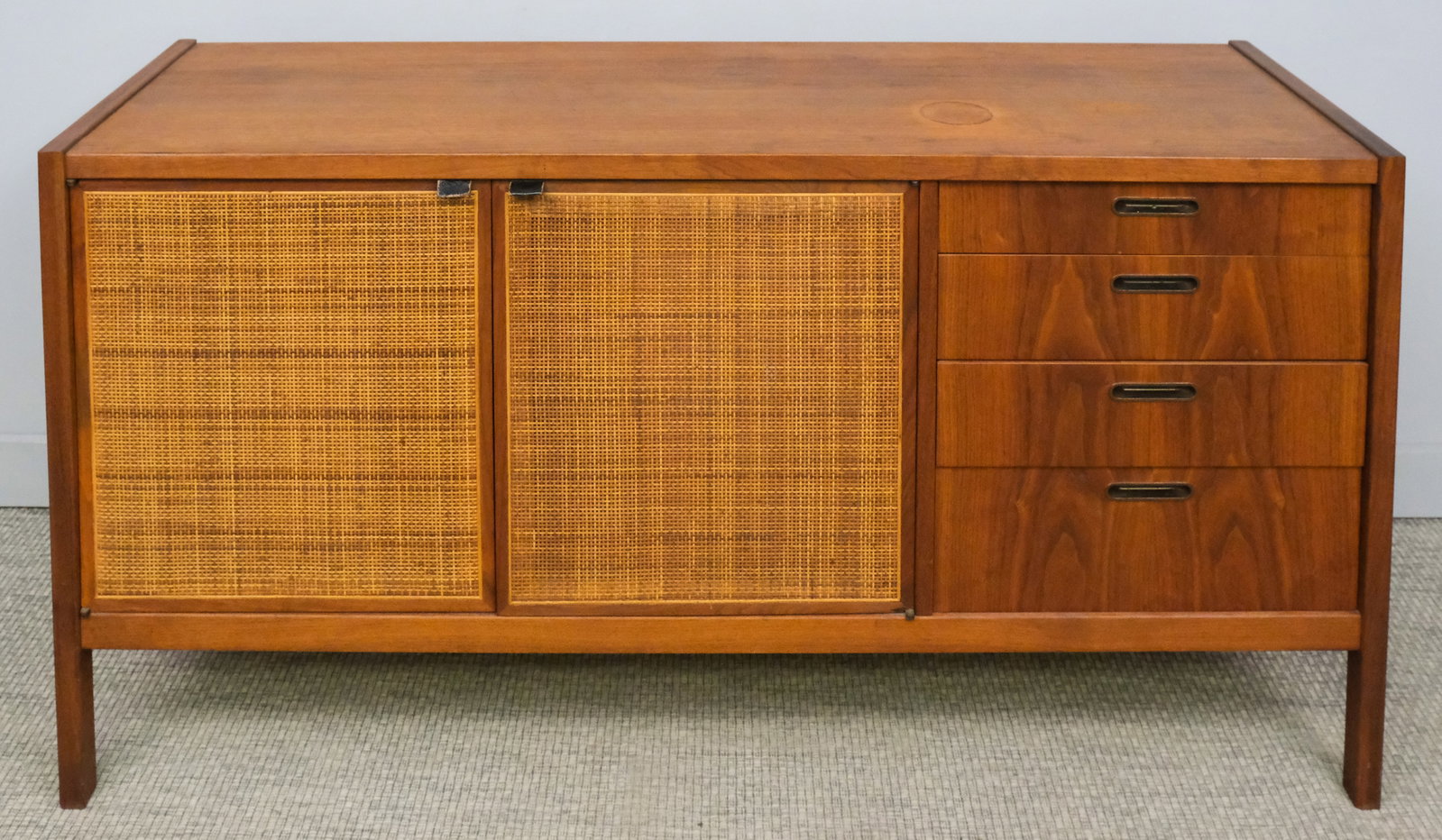 Mid-Century Modern Caned Credenza Sideboard: Mid-century modern style credenza sideboard with two caned cabinet doors, four drawers, one fitted for silverware, 32" H x 60 1/2" W x 18 1/4" L.