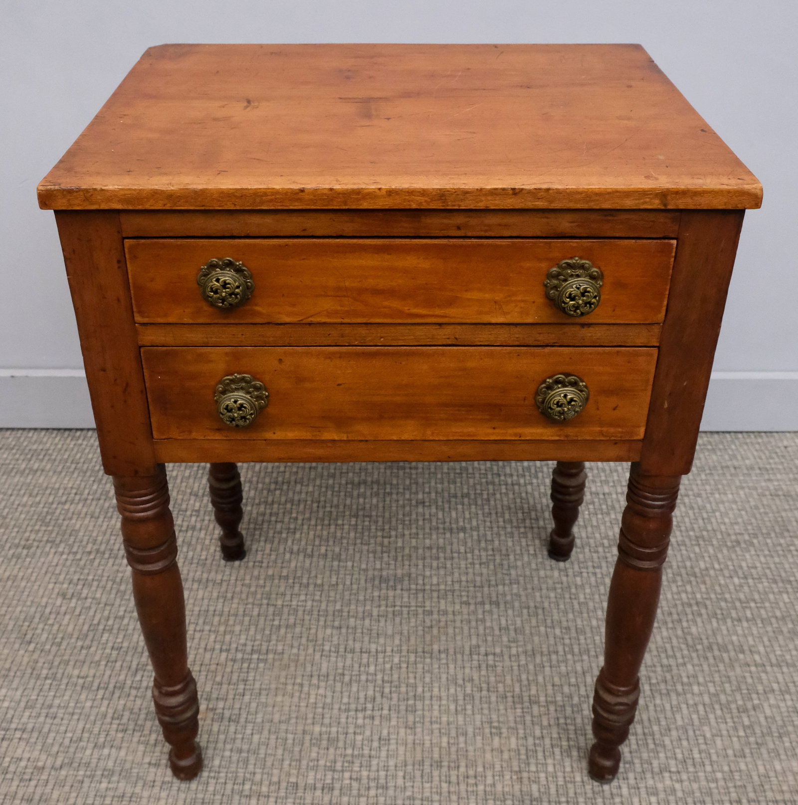 Antique American Empire Side Table: American, 19th century Empire side table with two drawers, on turned legs, 29" H x 21 1/4" W x 16 1/4" L.