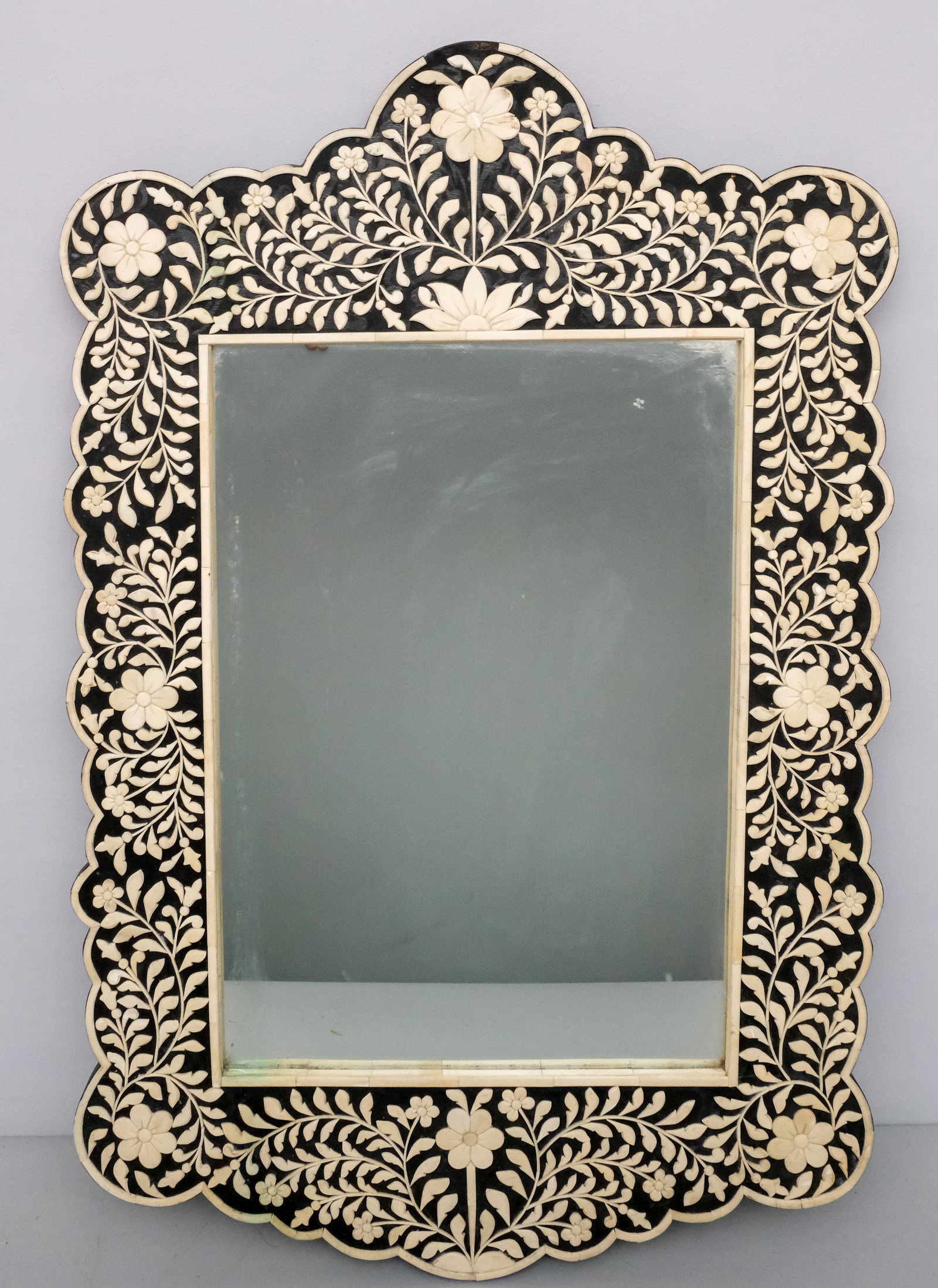 Moorish Style Bone Inlay Mirror: 20th century Moorish style ebonized frame mirror decorated with bone inlay, 36 1/4" x 23 1/2".