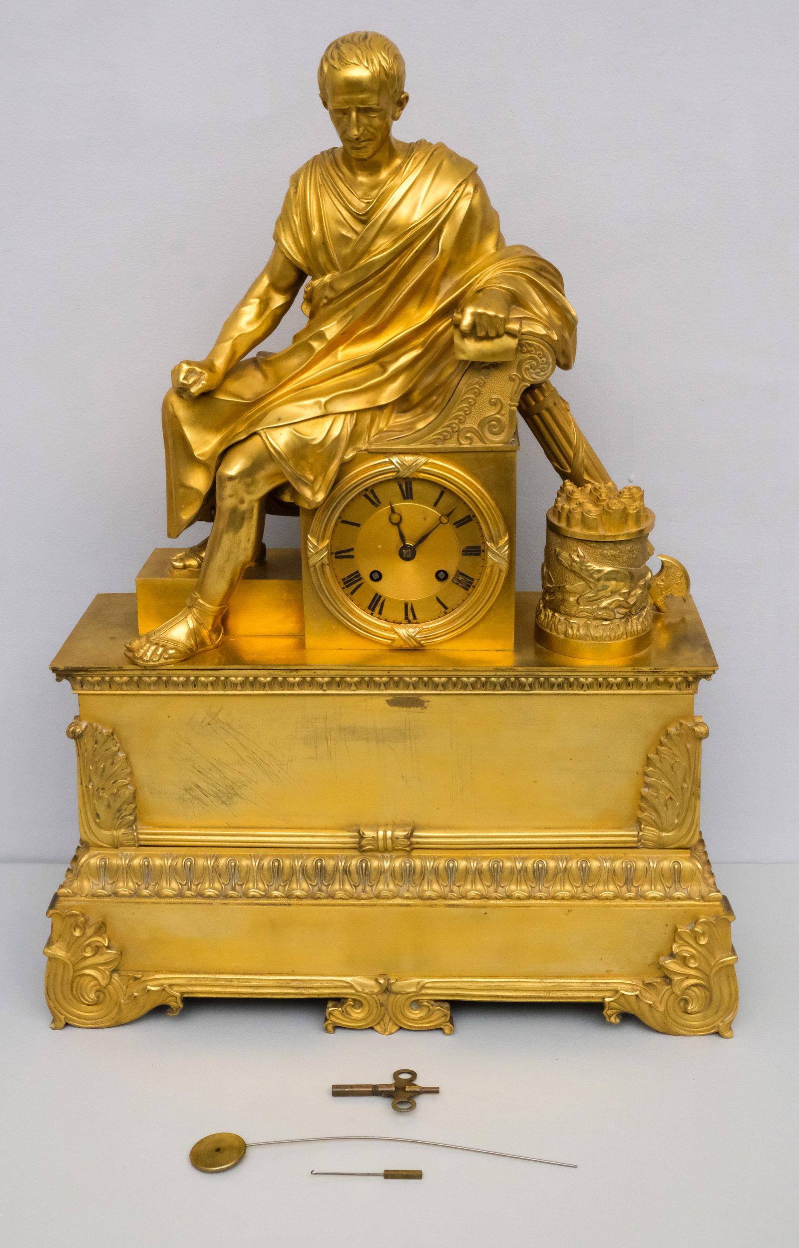 Large Antique Gilt Bronze Clock, Att. Roy et Fils: Large gilt bronze mantel clock topped with a reclined Julius Caesar. Roman numeral face and fine gilding. 16 1/2" x 22".
