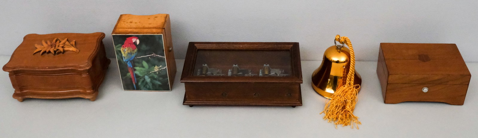 Vintage Music Boxes Lot: Including a skeleton example and another decorated with a parrot.