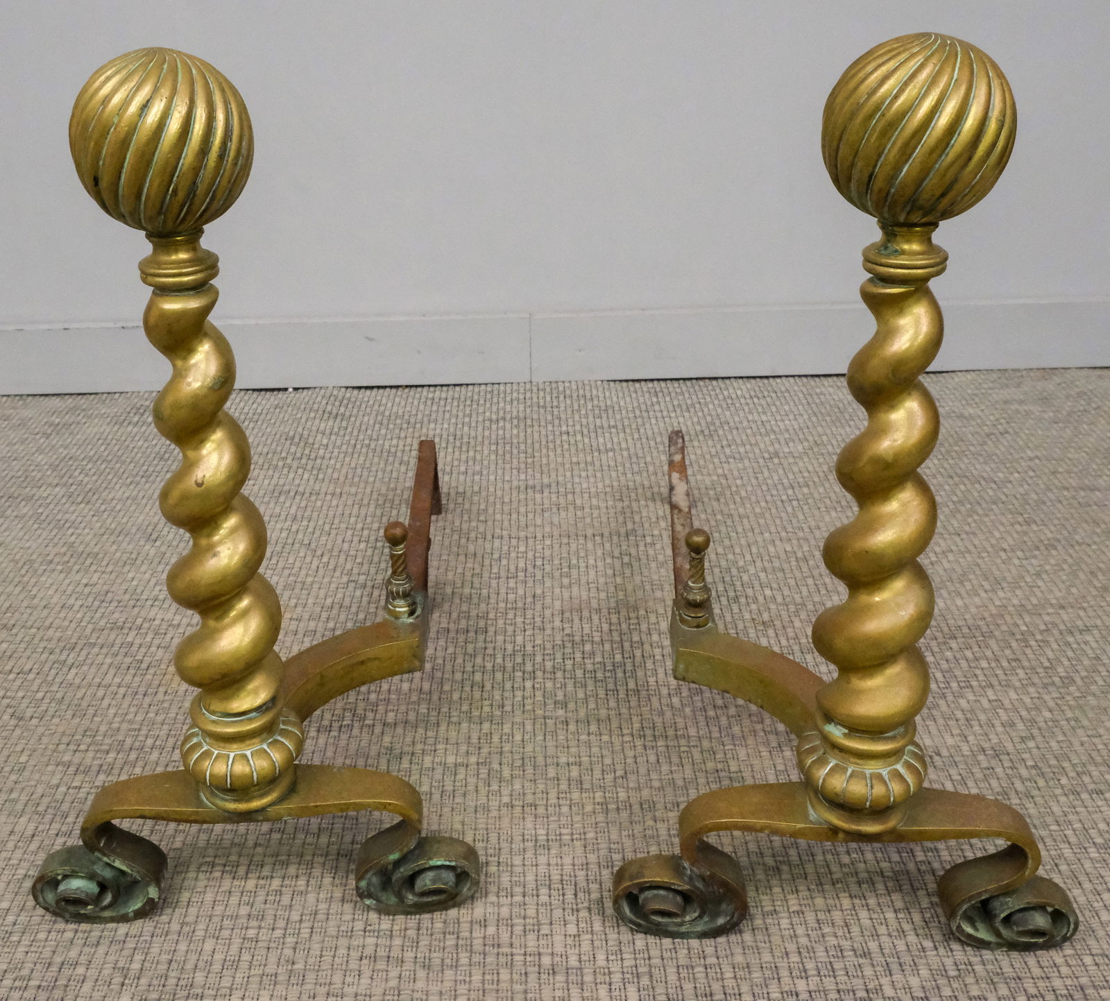 Pair of Brass Barley Twist Andirons: Pair of late 19th century brass barley twist andirons with brass ball tops, with scrolled feet, 25 1/2" H x 13 1/2" W x 26" L.