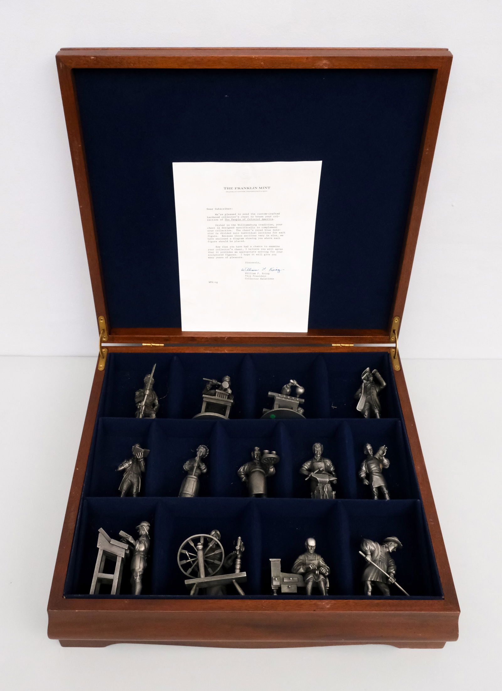 Franklin Mint, "The People of Colonial America": Franklin Mint collector's custom-crafted chest with 13 pewter Colonial American figures, styled in the Williamsburg tradition, with letter, 5 1/4" H x 17 3/4" W x 16 3/4" L.