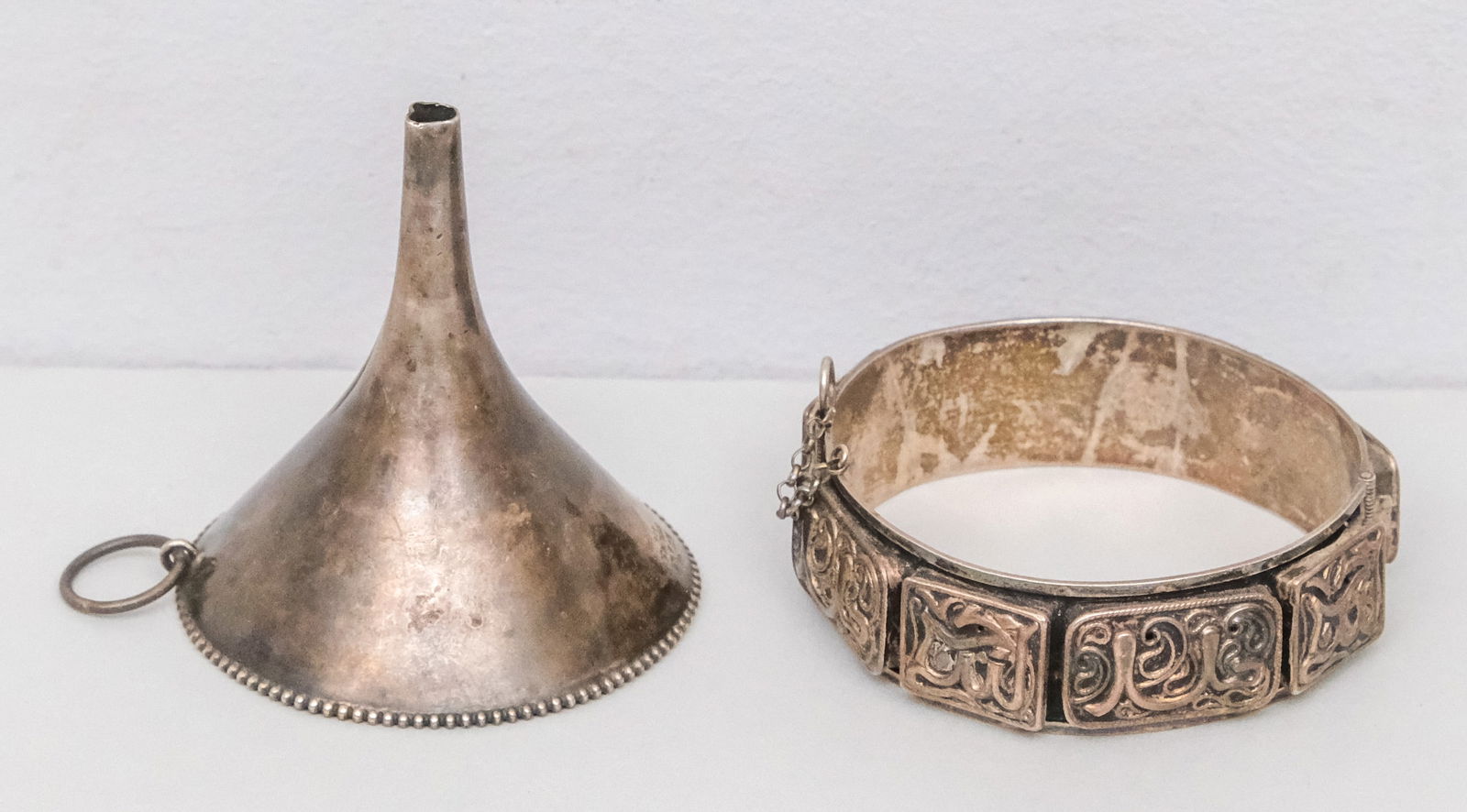 Sterling Silver Flask Funnel and Bracelet: The bracelet apparently unmarked, the funnel by Wallace. 1.7 troy combined. Funnel 2 3/8" x 2 5/8".