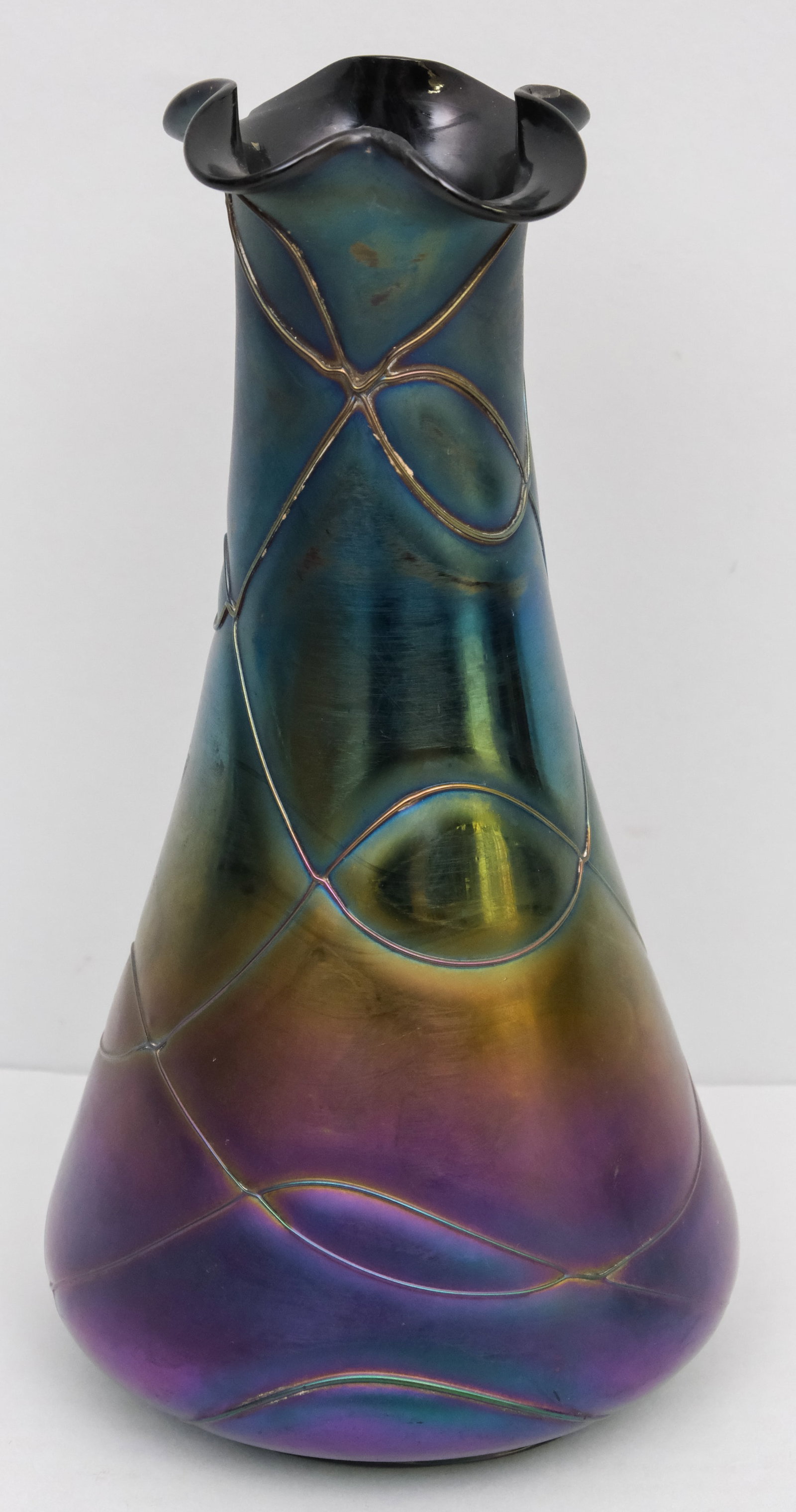 Antique Loetz Style Art Glass Vase: iridescent body with ruffled top edge and applied threading. 10".