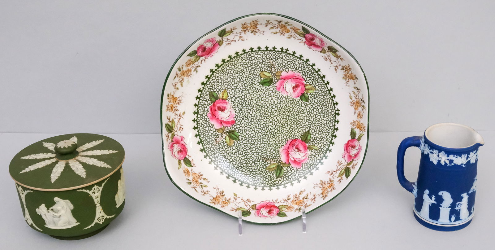 Two Antique Wedgwood Jasperware Articles: Comprising a covered box and creamer. Together with a Caludon bowl. Bowl 9 3/4".