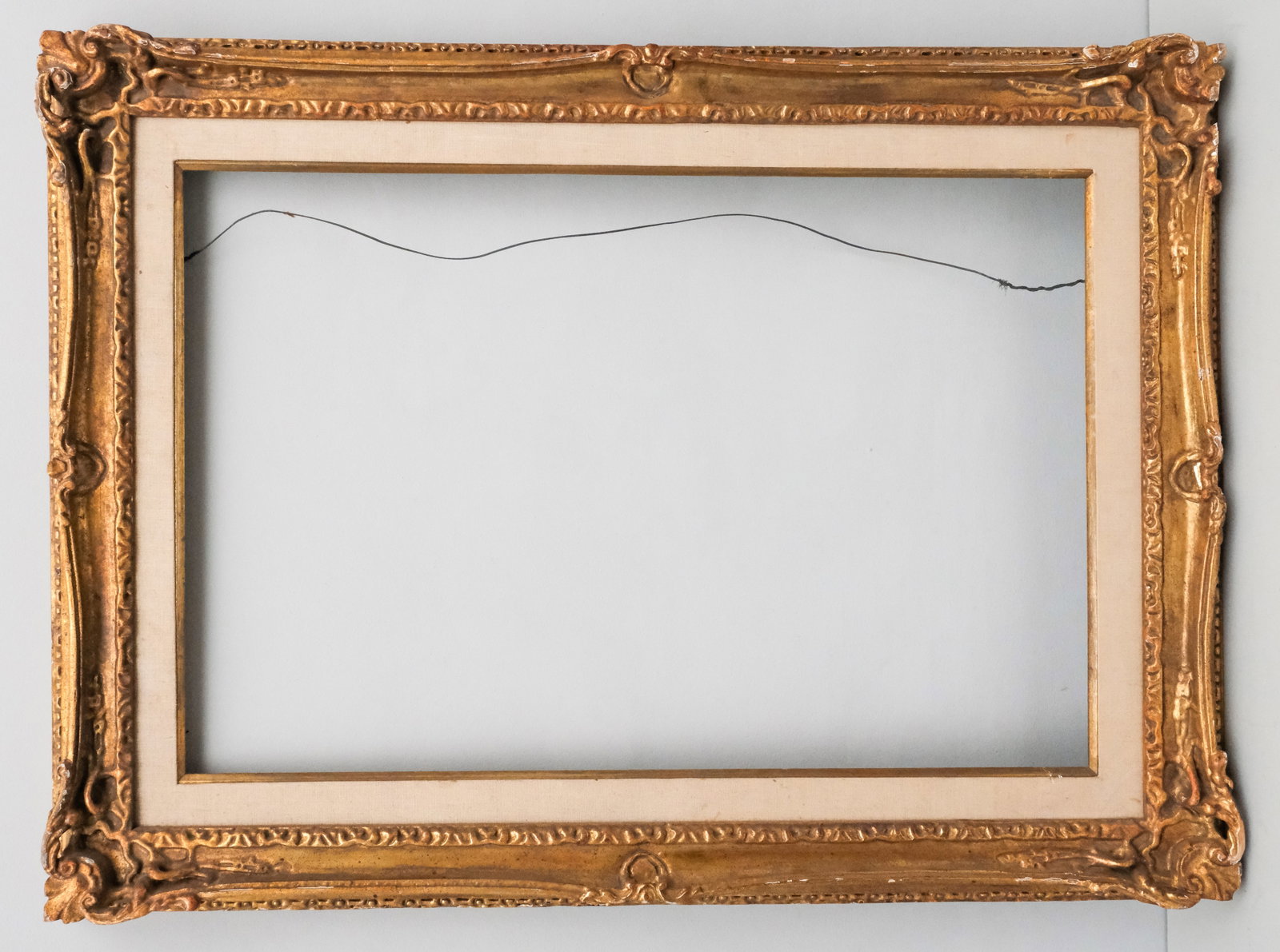 Louis XV Giltwood Frame 21" x 32": American, 20th century, a very finely wrought custom Louis XV style carved frame. Overall 30" x 40 1/2", rabbet 21" x 32", molding 4 1/2".