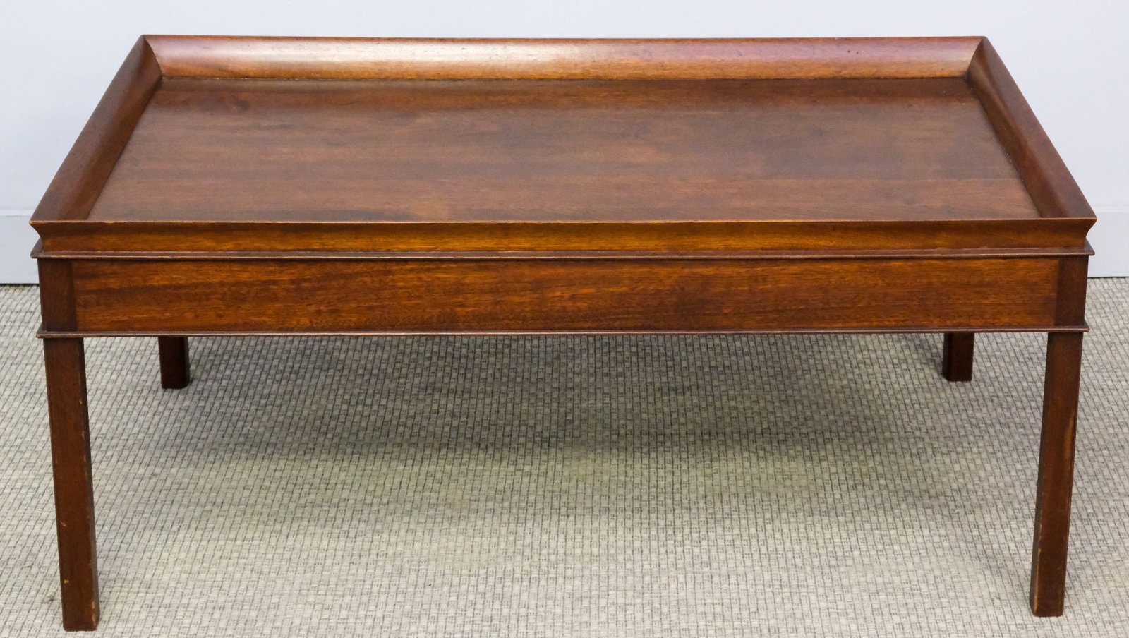 Modern Coffee Table: Modern, rimmed coffee table with squared legs, 25" H x 44 3/4" W x 20" L.