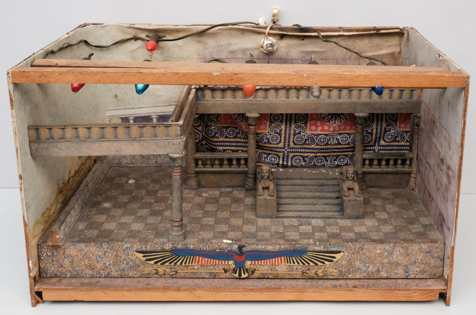 Vintage Egyptian Revival Diorama or Set Design: Intricately detailed with sphinx statutes and a paisley curtain, lit with Christmas lights. 14" x 16 3/4" x 28 1/4".
