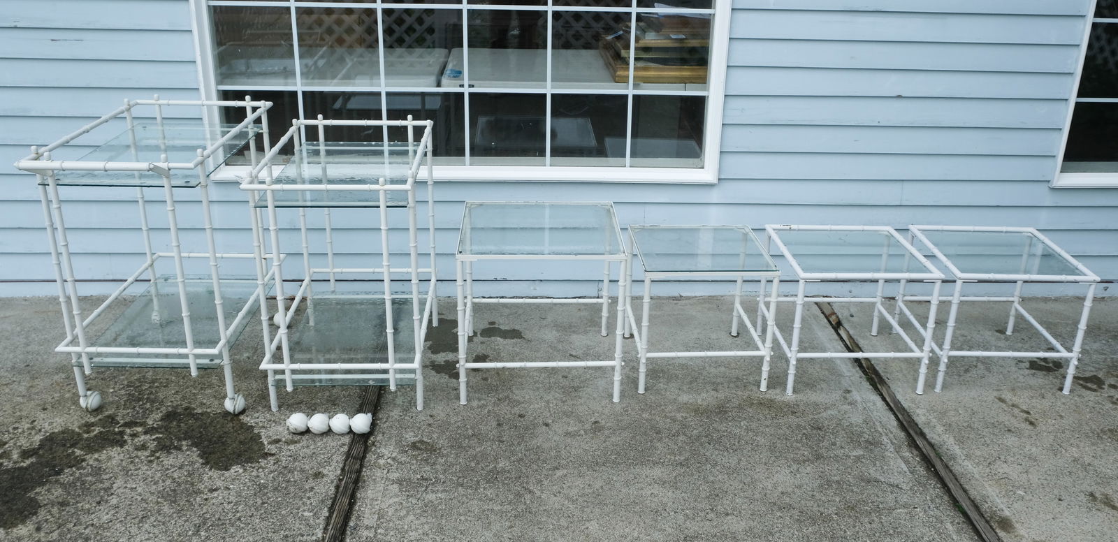 Set of 6 Faux Bamboo Patio Furniture: Set of 6 mid-century faux bamboo metal painted white patio furniture with glass surfaces, including four small side tables, and two bar carts, smallest 16" H x 17 1/2" W x 17 1/2" L, largest 32 1/4" H