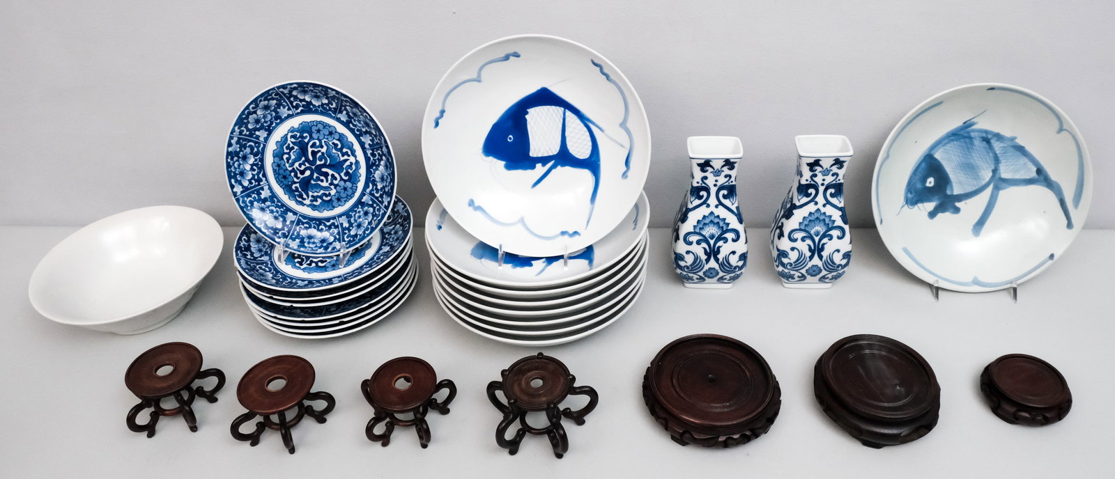 Large Group of Chinese Blue & White Porcelain: Including vases, dishes, stands and more.