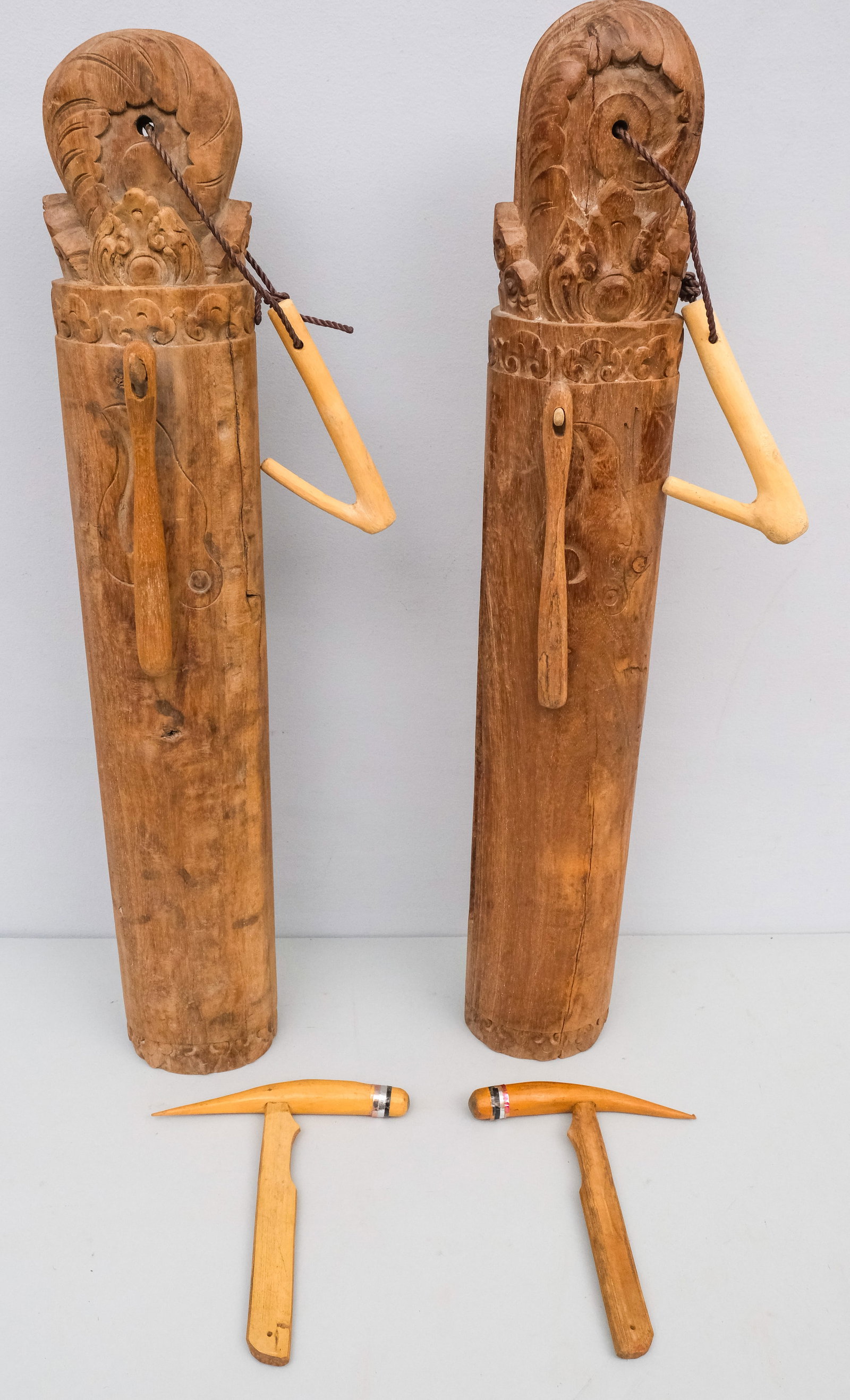 Two Carved Wooden Temple Bells: With hammers and batons. 28".