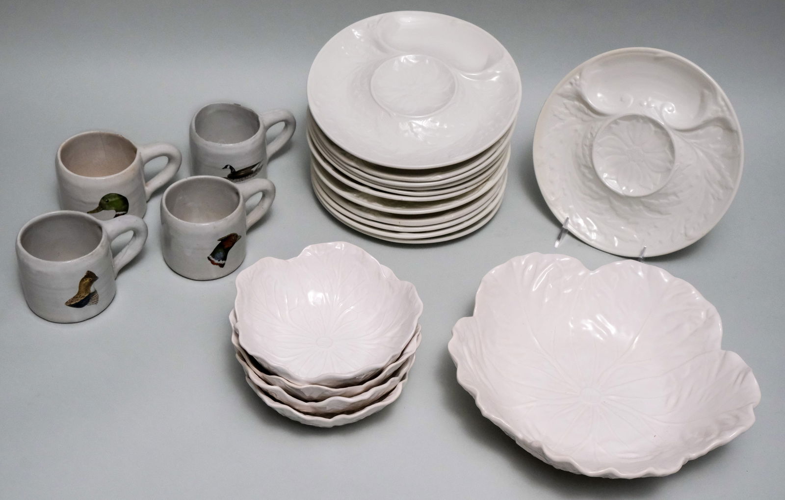 Group of Bordallo Pinheiro Lily Pad Bowls: With Gien underplates, and some mugs by Malcolm T. Fleming. Bowls 7" and plates 9 1/4".