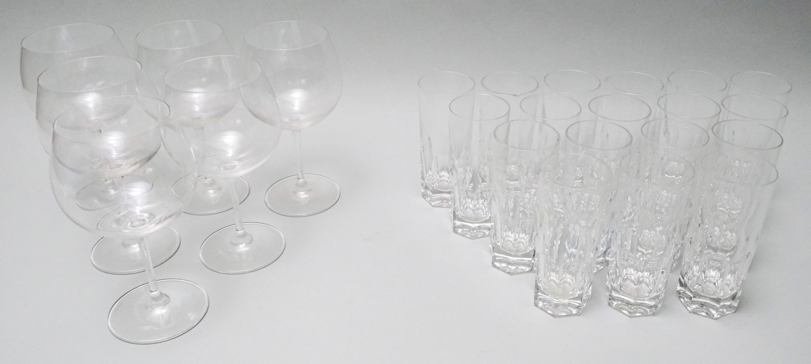 Group of Riedel Crystal Stemware: Comprising (18) 2 3/8" x 5 1/4" tumblers (one with flake) and (6) large wine glasses 3 1/2" x 7 1/2".
