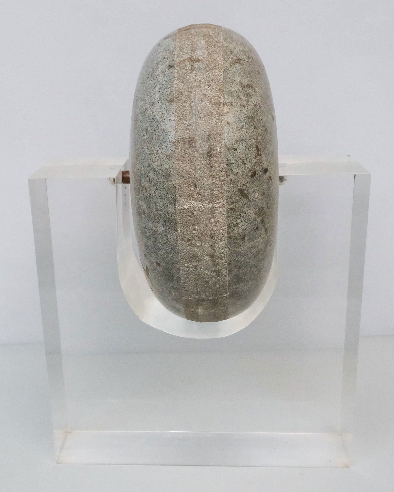 Curling Stone with Lucite Stand: Granite curling stone inscribed "J. B. L.", mounted on a lucite stand, 17" H x 12" W x 5 1/2" L.