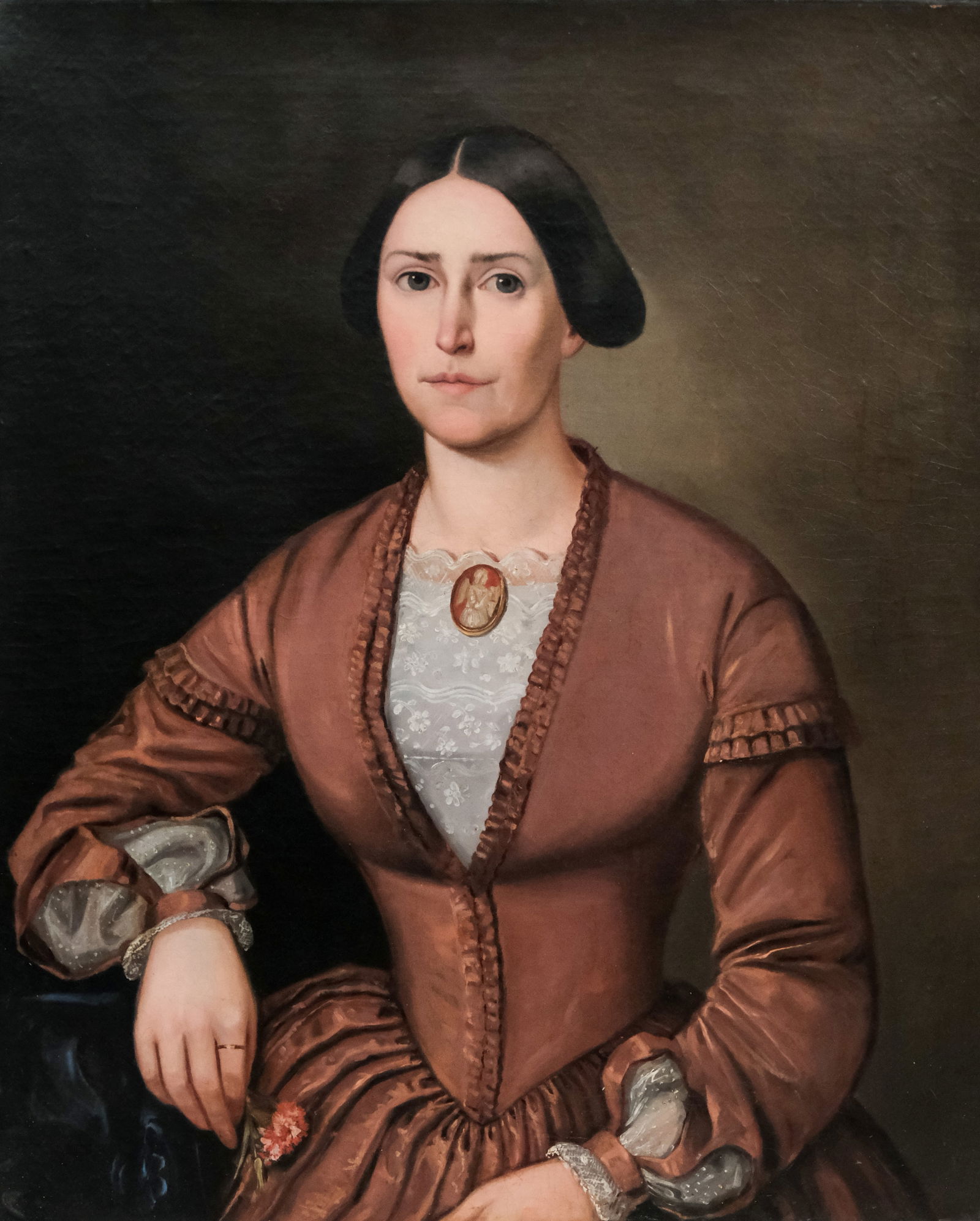 American School, Portrait of a Lady: American, ca. 1850, oil on canvas portrait of a lady in a fancy red dress with a cameo brooch and a flower, she wears a wedding ring on her forefinger (a southern tradition), 25" x 30" canvas, unframe