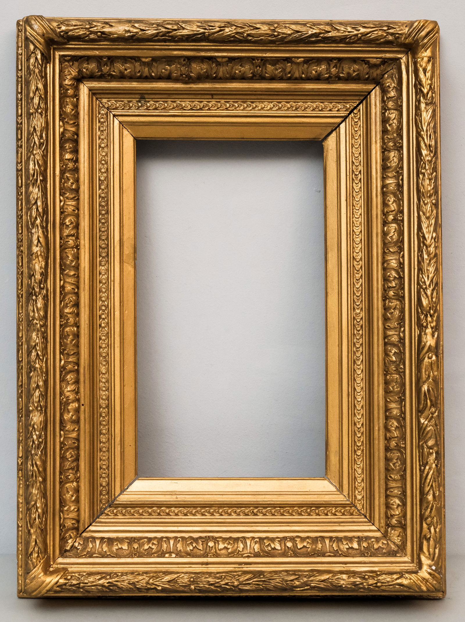 French Giltwood Salon Frame 8" x 14": American ca. 1860, acanthus cove with laurel and berry top edge. Overall 16 1/2" x 22 1/2", rabbet 8" x 14", 4 1/2" molding
