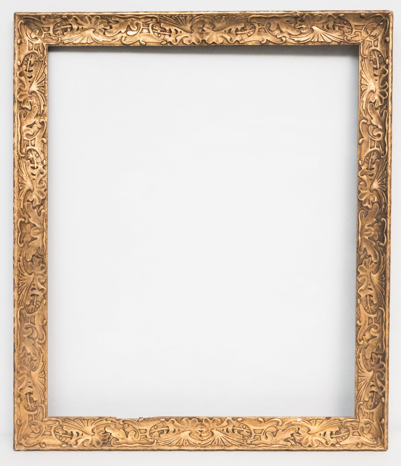 American Arts & Crafts Gilt Frame 26" x 31": American, ca. 1900, having art nouveau motifs. Overall 31" x 35 3/4", rabbet 26" x 31", molding 2 1/2".