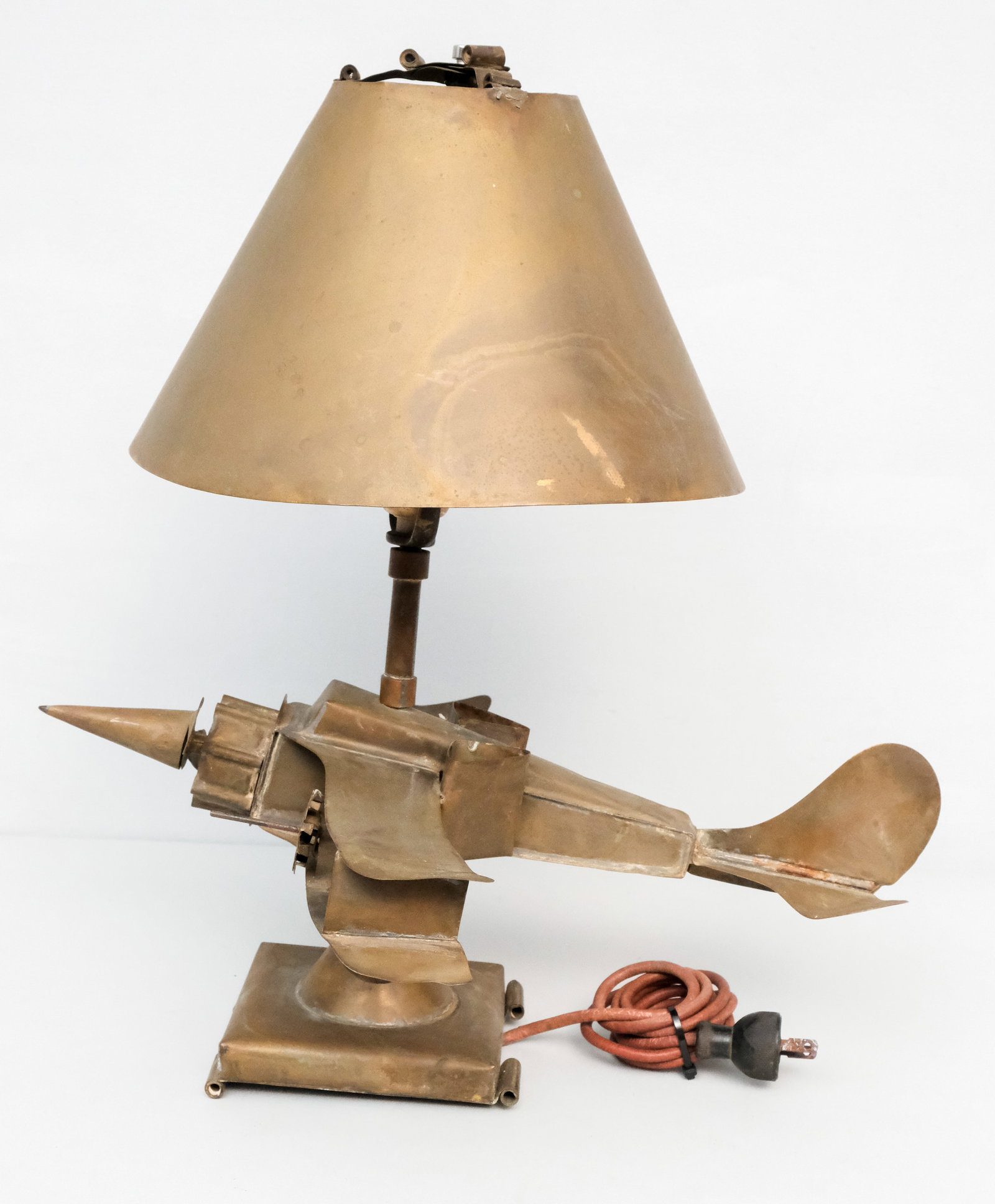Vintage Folk Art Brass Fighter Plane Lamp: Dynamic artist made airplane lamp with matching brass shade. 19 1/2".