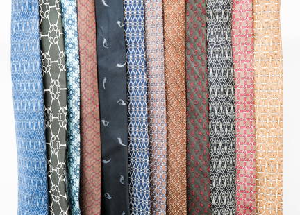 12 Hermes Silk Ties: A dozen patterned silk ties by Hermes. See photos for details.