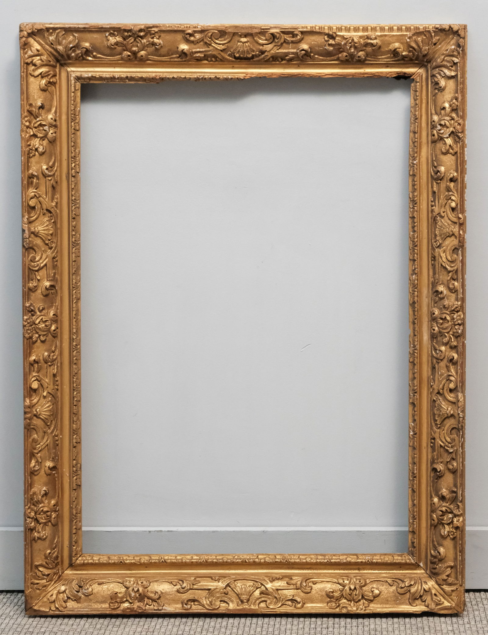 Early English Giltwood Frame 23" x 33": English, 18th century, carved and gilded in the Italian taste. Overall 30 1/2" x 40 1/2", rabbet 23" x 33", 4" molding