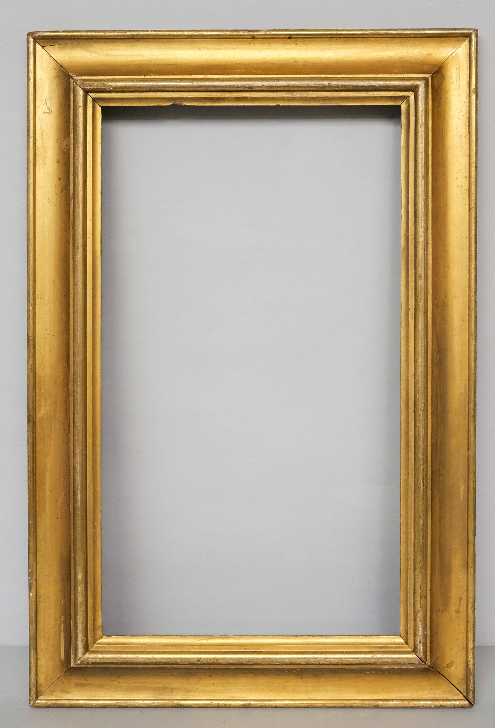 American Giltwood Frame 16" x 28": American, ca. 1830, having reverse profile. Overall 23 1/4" x 35 1/4", rabbet 16" x 28", 4" molding