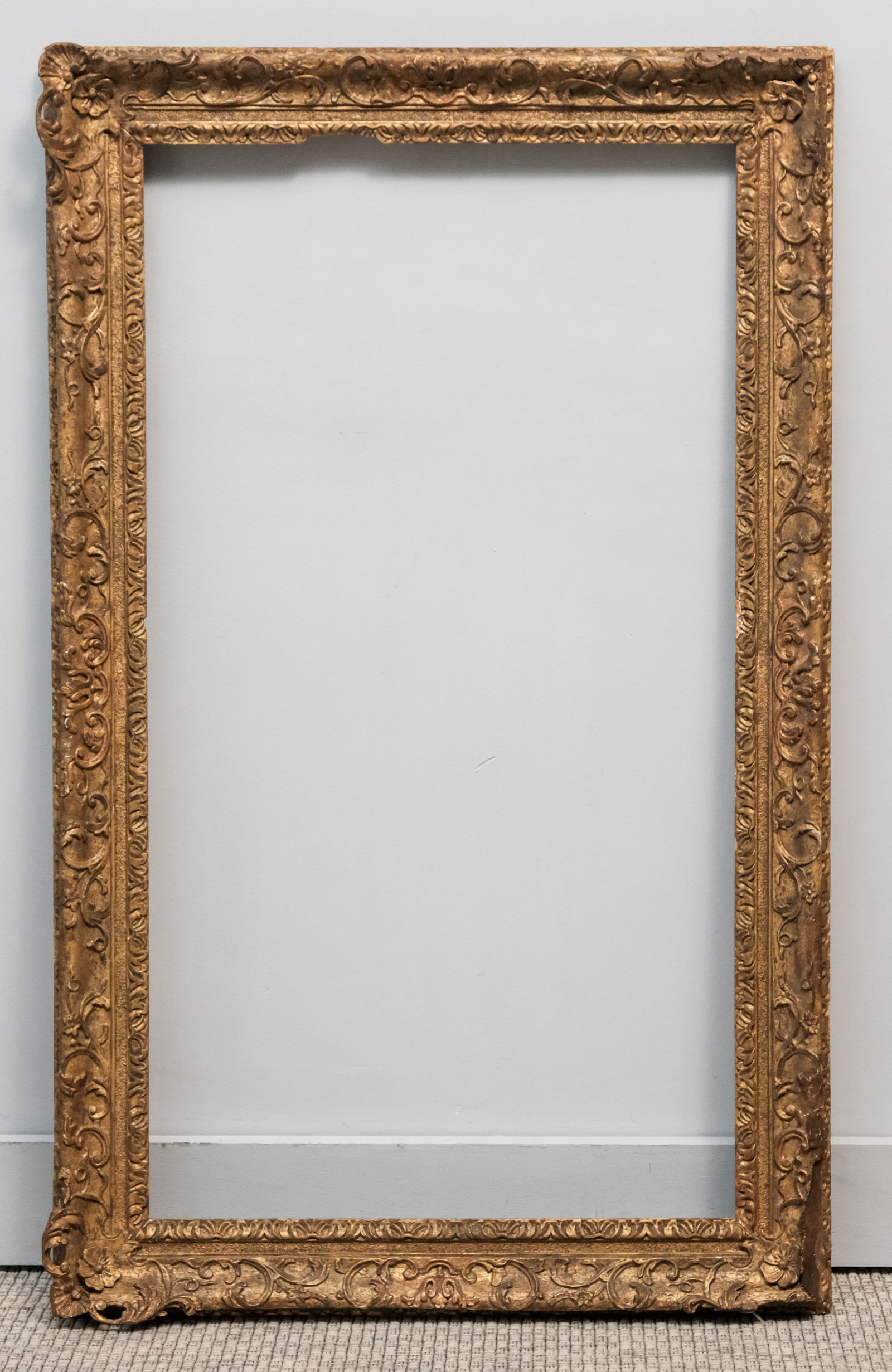 English Lely Giltwood Frame 20" x 35 3/4": English, 18th century, hand carved and gilded in the style favored by Sir Peter Lely. Overall 26" x 42", rabbet 20" x 35 3/4", 3 1/2" molding
