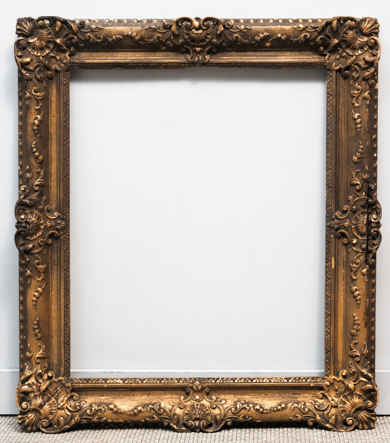 Louis XIV Giltwood Frame 25" x 30": English, 18th century, carved and gilded in the French taste, in a great standard size. Overall 34" x 39", rabbet 25" x 30", 5" molding